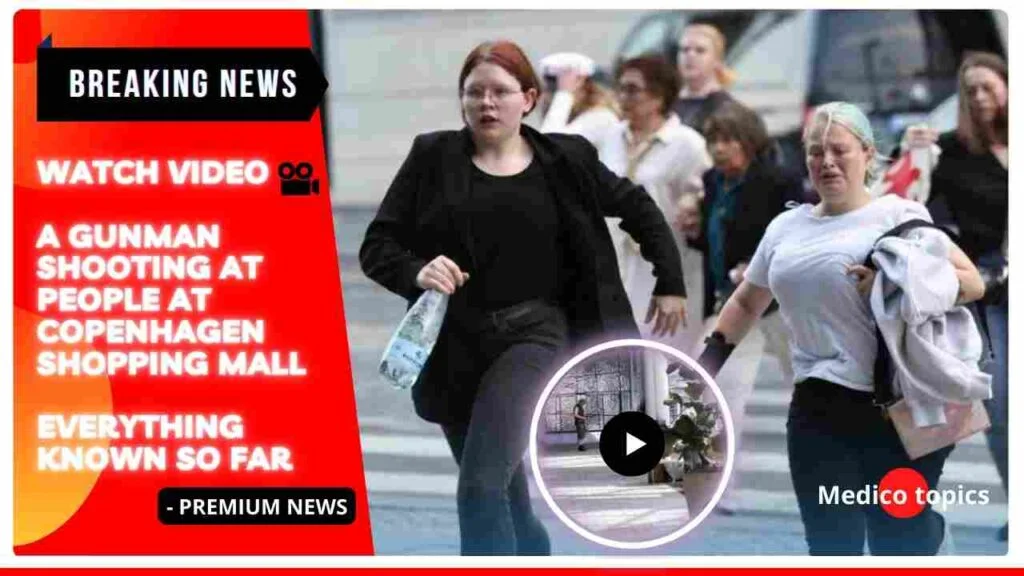 Watch video of a gunman shooting at people at Copenhagen shopping mall